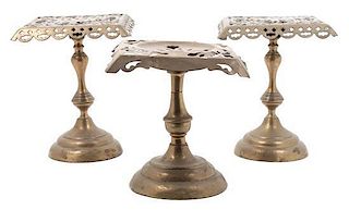 A Group of Three Brass Trivets Height of first 8 inches.