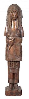 A Carved Wood Cigar Store Indian Chief Height 67 inches.