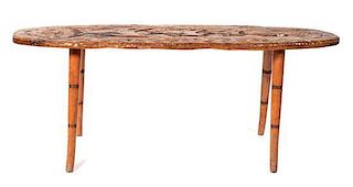 An American Carved Occasional Table Width 52 inches.