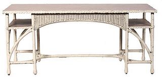 An American Wicker Console Table Height 29 1/2 x width 67 x depth 22 1/2 inches.