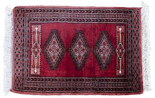 An Oriental Wool Rug 3 feet 1 inch x 2 feet 1 inch.