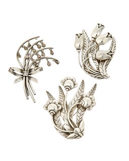 A group of Hector Aguilar sterling silver floral brooches