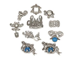 A large group of Los Castillo silver brooches