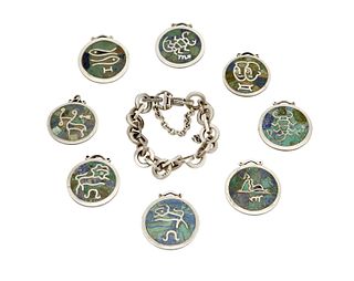 A mixed group of Mexican silver and hardstone Zodiac jewelry