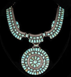 A FINE NAVAJO STERLING AND TURQUOISE CLUSTER NECKLACE