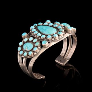 A STERLING AND TURQUOISE BRACELET ATTRIBUTED ZUNI