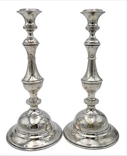A Pair of Tall Silver Candlesticks