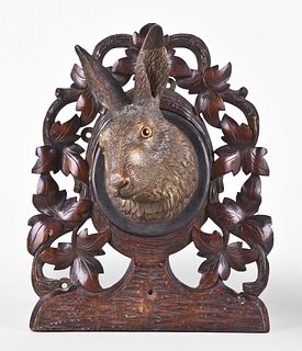 A good Black Forest carved hare with leaf and twig plaque