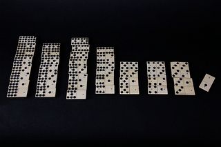 Collection of 42 Bone and Ebony Dominos, 19th Century