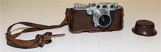 A Leica Camera Width of leather case 6 1/8 inches.