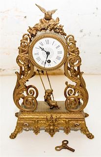 A Louis XV Style Gilt Metal Mantel Clock Height 12 inches.