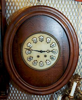 A Continental Oak Wall Clock Height 24 inches.