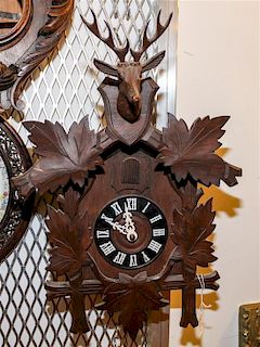 A German Black Forest Style Cuckoo Clock Height 16 inches.