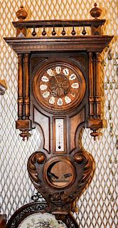 * A French Walnut Wall Clock. Height overall 36 inches.