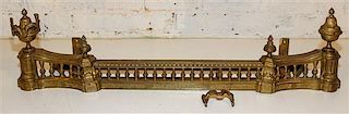 A French Gilt Metal Fire Fender Height 10 3/8 x width 38 1/2 inches.
