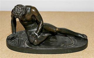 A Continental Bronze Figure, After the Antique Width 10 3/4 inches.