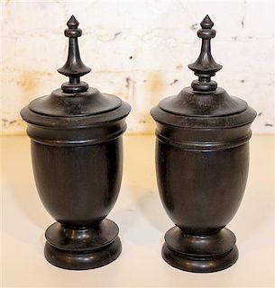 * A Pair of Turned Wood Urns. Height 11 inches.