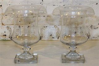 * A Pair of Glass Urns. Height 12 inches.