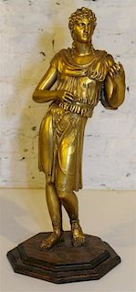 * A Gilt Bronze Figure. Height 21 inches.