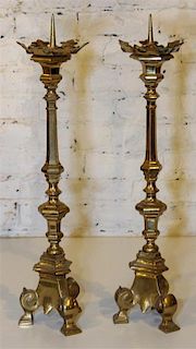* A Pair of Brass Sticks. Height 24 inches.