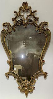 * A Rococo Style Cartouche Form Mirror. Height 46 1/2 x width 25 1/4 inches.