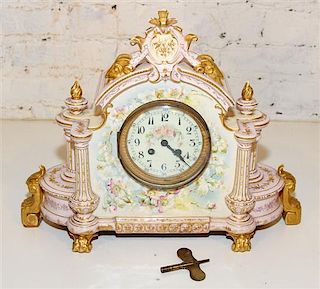 A Continental Porcelain Mantle Clock. Height 14 inches.