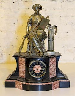 * A Victorian Figural Mantel Clock. Height 22 inches.