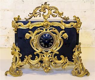 * A Victorian Bronze and Slate Mantel Clock. Width 18 inches.