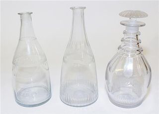 A Group of Three Cut and Etched Glass Decanters Height of tallest 9 1/4 inches.
