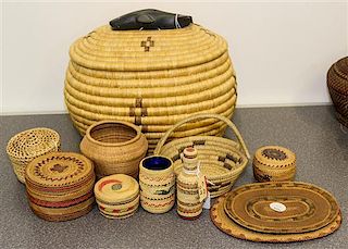 A Collection of Eleven Woven Baskets Height of largest 10 inches.