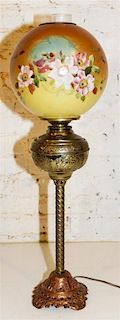 A Victorian Cast Metal and Painted Glass Table Lamp Height 29 1/2 inches.