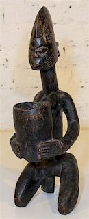 * A Bakuba Style Vessel. Height 20 inches.
