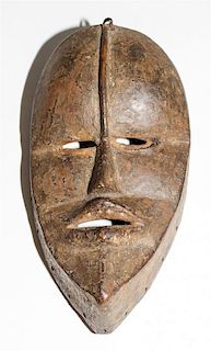 * A Dan Poro Society Mask. Height 9 1/4 inches.
