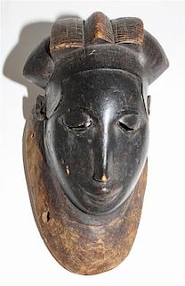 * A Yaure Painted Wood Mask. Height 12 inches.