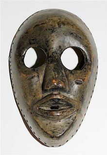 * A Dan Wood Mask. Height 8 3/4 inches.
