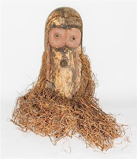 * A Wabembe Wood and Grass Fiber Mask. Height 18 inches (without grass).