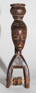 * A Senufo Wood Figural Pulley. Height 8 3/4 inches.