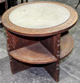 * A Carved Hardwood and Leather Inset Drum Table, likely African Height 23 1/2 x diameter 30 inches.