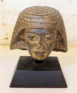 * An Egyptian Style Cast Stone Bust. Height 6 1/2 inches.
