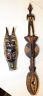 Two Carved African Articles Height of tallest 40 1/2 inches.