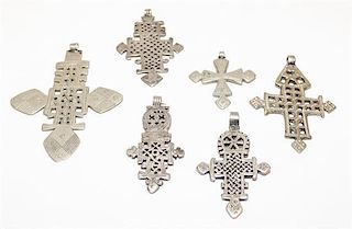 A Collection of Ethiopian Silver and Silvered Metal Cross Pendants Height of largest 4 inches.