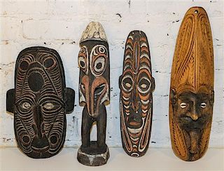 A Group of Sepik River Valley Articles, New Guinea Height of figure 15 1/2 inches.