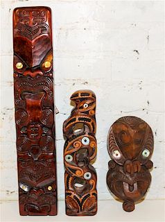 A Group of Three Maori Carved Wood Masks Height of tallest 21 inches.