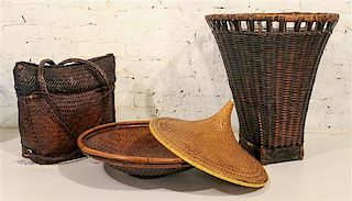A Group of Three Woven Baskets Height of tallest 21 inches.