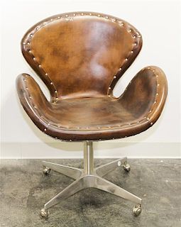 * A Riveted Aluminum and Leather Swivel Office Chair, Restoration Hardware Height 34 inches.