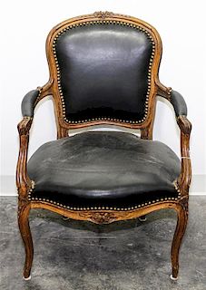 * A Louis XV Style Walnut Fauteuil Height 33 inches.
