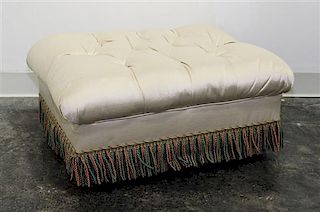 An Upholstered Ottoman Height 12 1/2 x width 25 1/2 x depth 19 inches (overall).