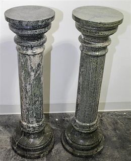 * Two Turned Marble Pedestals. Height 39 inches.