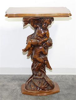 * A Carved Walnut Figural Pedestal. Height 39 inches.