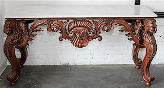 * A Carved Mahogany Console Table. Height 33 1/2 x width 68 x depth 25 inches.